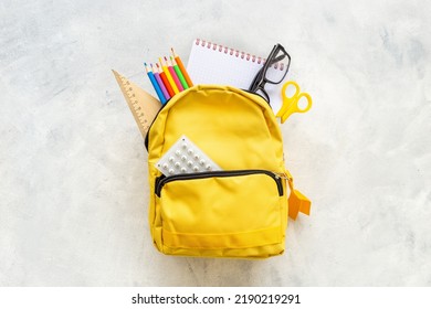 School Bag With With Colorful School Items, Top View