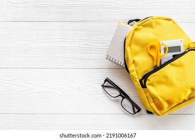 School Bag With With Colorful School Items, Top View