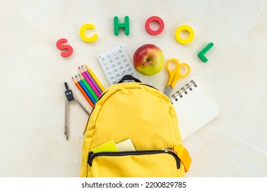 School Bag With With Colorful School Items, Top View