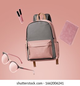 School bag floating with school items advertising photography by