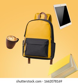 School bag floating with school items advertising photography
