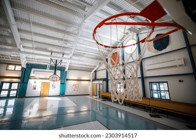 School baksetball court with hoop and backboard gymnasium floor