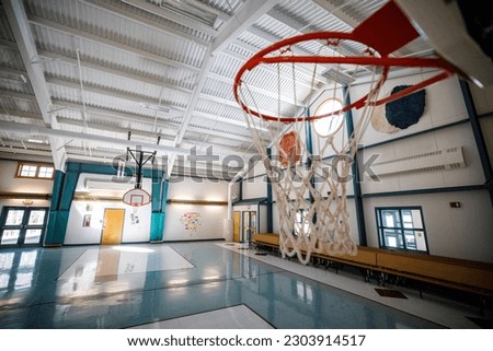 School baksetball court with hoop and backboard gymnasium floor