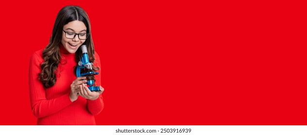 School biology girl hold microscope. Teen girl student of biology. Back to school. Student with microscope isolated on red. Biology science for schoolgirl. Microscope research. Copy space banner - Powered by Shutterstock