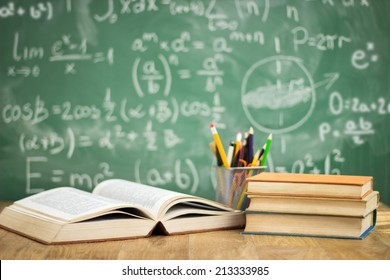 School books on desk, education concept - Shutterstock ID 213333985