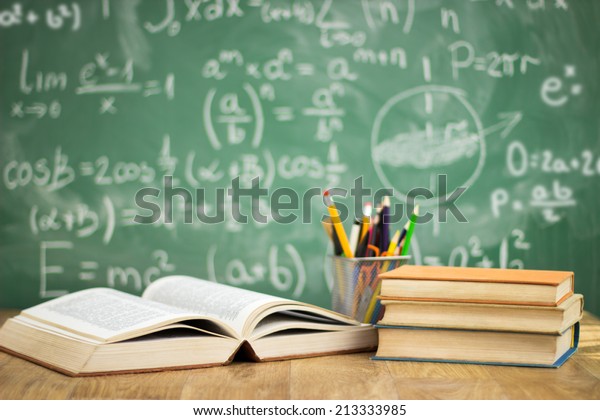 School books on desk, education concept