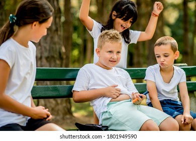 School Boy With Diabetes Injecting Insulin After Physical Education, Friends Support Him.