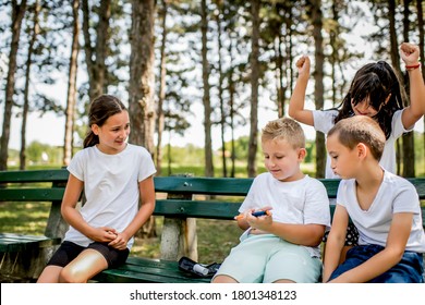 School Boy With Diabetes Testing His Blood Sugar After Physical Education, Friends Support Him.