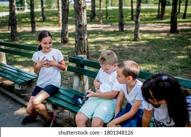 School Boy With Diabetes Testing His Blood Sugar After Physical Education, Friends Support Him.