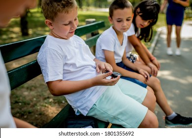 School Boy With Diabetes Testing His Blood Sugar After Physical Education, Friends Support Him.