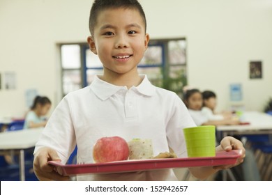 School Boy Holding Food Tray In School Cafeteria