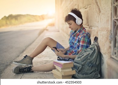 School Boy Listening To Music