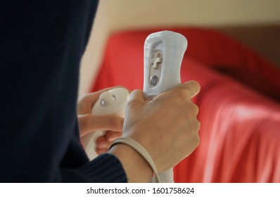 School Boy With Remote Control Making Gymnastic. Fitness Console Game. Yoga Training. Modern Technology and Health Life.