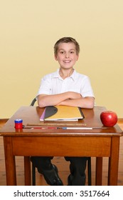 School Boy Sitting Up Straight In Class