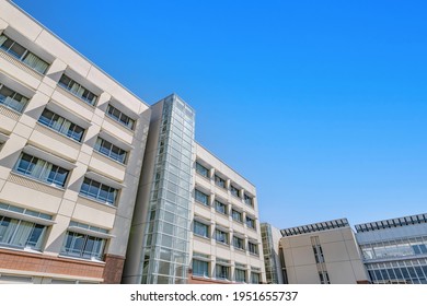 School building and spring blue sky - Shutterstock ID 1951655737