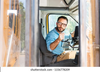 School Bus Driver Losing Door With Lever And Looking Back