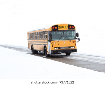 School Bus Driving In The Winter On Rural Road