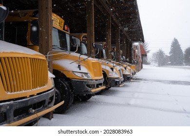 School Bus Lined Up In Snow