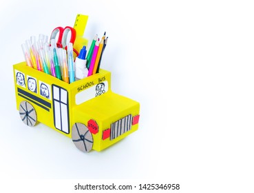 School Bus Made Of Cardboard. DIY Children's Pencil Case For Stationery Paper Craft. Back To School. Children's Garden. White Background