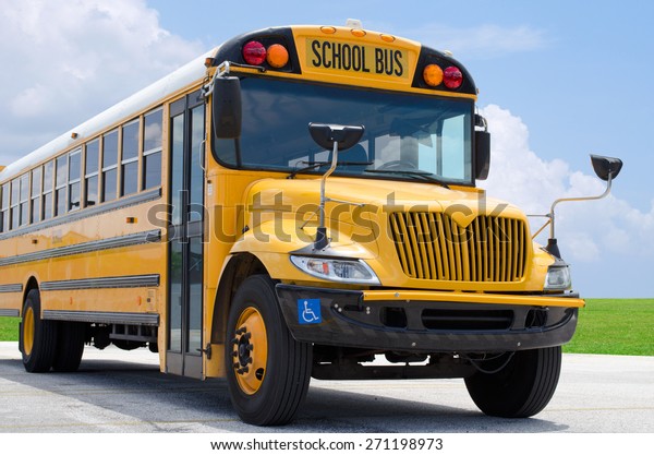 School bus on\
blacktop with clean sunny\
background