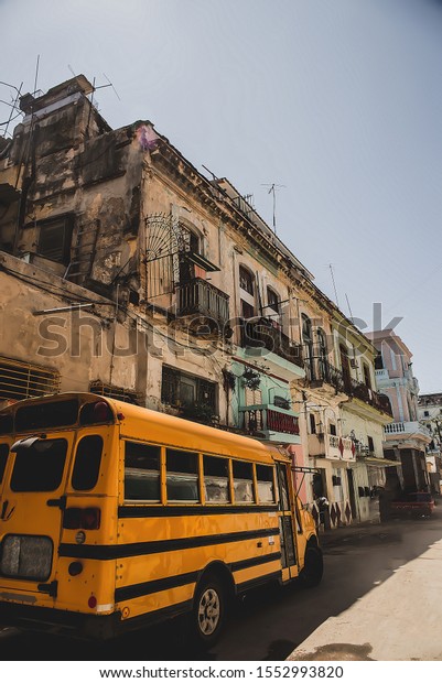 School bus on a road in a street in the capital city\
of Havana in Cuba