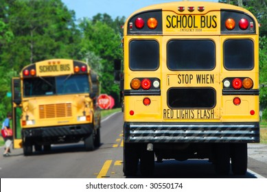 School Bus On Rural Road Picking Up Children