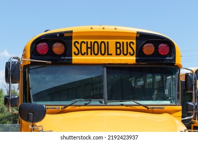 School Bus Staging Area Waiting For Students. School Buses Are An Effective Transportation Method In Rural Districts.