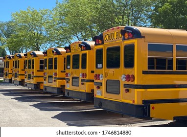 School Buses Lined Up With No Place To Go Since Schools Have Been Closed For In-person Learning Due To COVID-19 Pandemic.