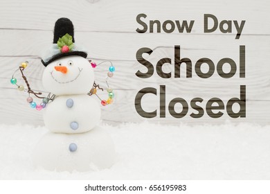 School Canceled Message, A Snowman With Text Snow Day School Closed On Weathered Wood