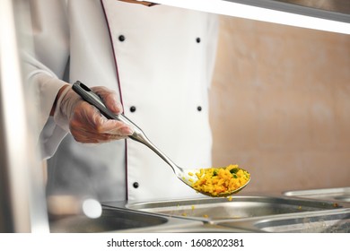 School Canteen Worker At Serving Line, Closeup. Tasty Food