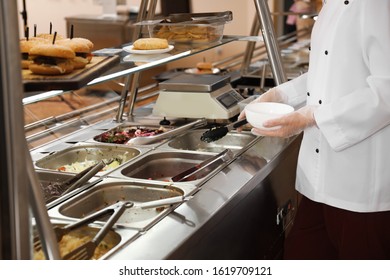 School Canteen Worker At Serving Line, Closeup. Tasty Food