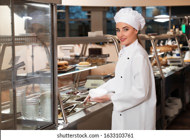 School Canteen Worker At Serving Line. Tasty Food