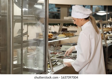 School Canteen Worker At Serving Line. Tasty Food