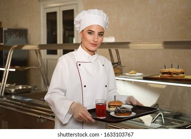 School Canteen Worker With Tasty Food Near Serving Line