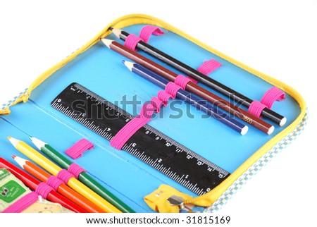 School case with a set of handles of pencils and a black ruler.