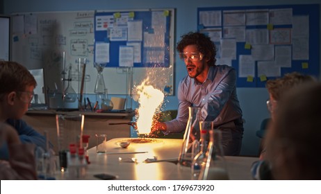 School Chemistry Classroom: Engrossed Children Watch How Enthusiastic Teacher Shows Science Experiment By Setting Powder On Fire Creating Beautiful Fireworks. Kids Getting Fun Modern Education