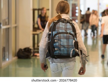School Child With School Bag Or School Satchel On The Back