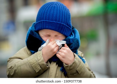 School Child Boy Blow His Nose. Sick Child With Napkin In Autumn Park. Allergic Kid, Flu Season. Kid With Cold Rhinitis, Get Cold. Back To School