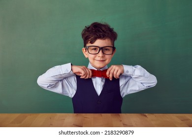 School child (boy) in classroom. Funny kid against green chalkboard. Idea and creativity concept. Copyspace on background. Back to school concept.  - Shutterstock ID 2183290879