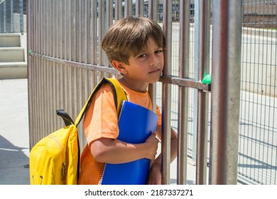 School Child Waiting To Enter School On The First Day Of School. Back To School.