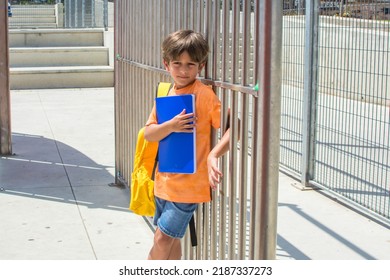 School Child Waiting To Enter School On The First Day Of School. Back To School. Lifestyle