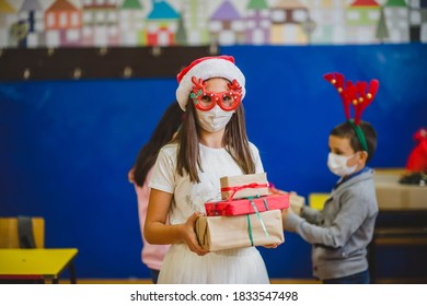 School Children Celebrating New Year In The Classroom. They Are Wearing Protective Face Mask.