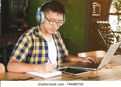 School Children Doing Homework With Computer