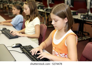 School Children Learning Computers In The Library Media Center.