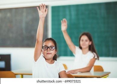 School Children Raised Hands Class Room Stock Photo 699073321 ...