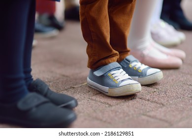 School Children's Feet Wearing Comfortable Shoes. Kids Boots. Parent's Care Before School Year. Back To School Concept