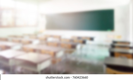 School Classroom In Blur Background Without Young Student; Blurry View Of Elementary Class Room No Kid Or Teacher With Chairs And Tables In Campus.