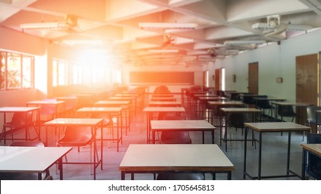 School Classroom Closed In Blur Background Without Young Student; Blurry View Of Empty Examination Class Room No Kid Or Teacher With Chairs And Tables In Campus University.