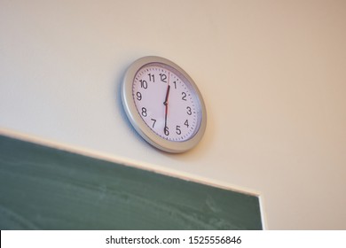 School Classroom With Green Blackboard On The Wall, Clock On The Wall In The Classroom, 
Blackboard Sponge