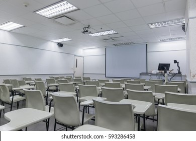 School classroom interior with desk and projector